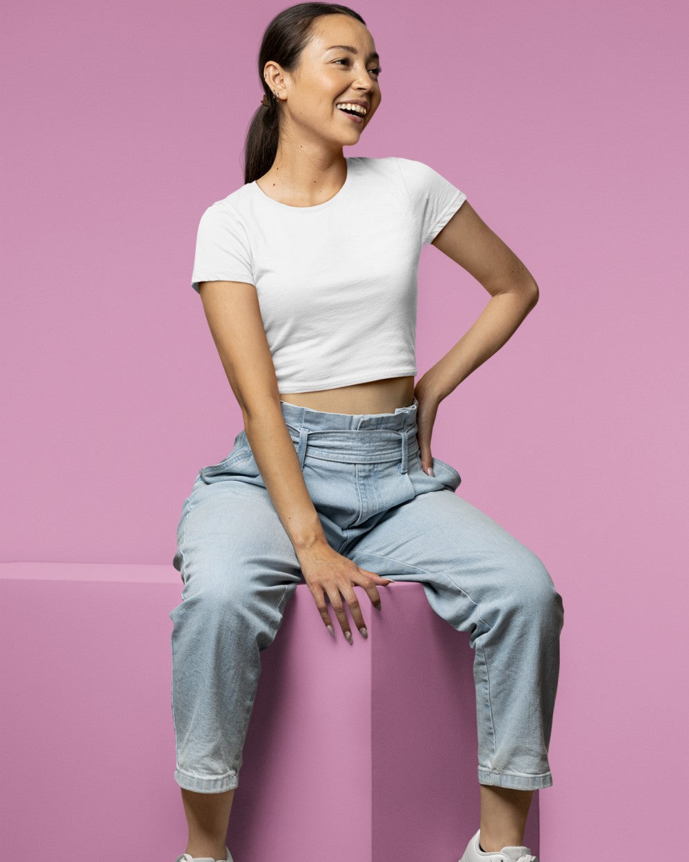 Female Model wearing the White plain Crop Top for a casual look.