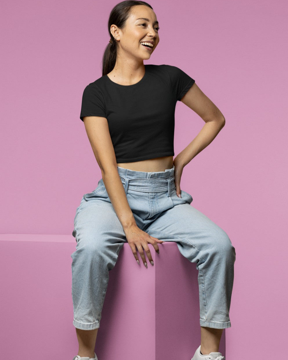 Female Model wearing the Black plain Crop Top for a casual look.