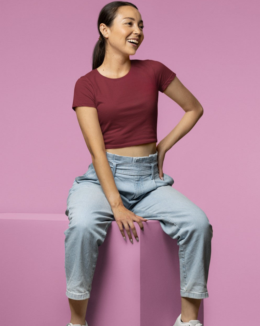 Female Model wearing the Maroon plain Crop Top for a casual look.