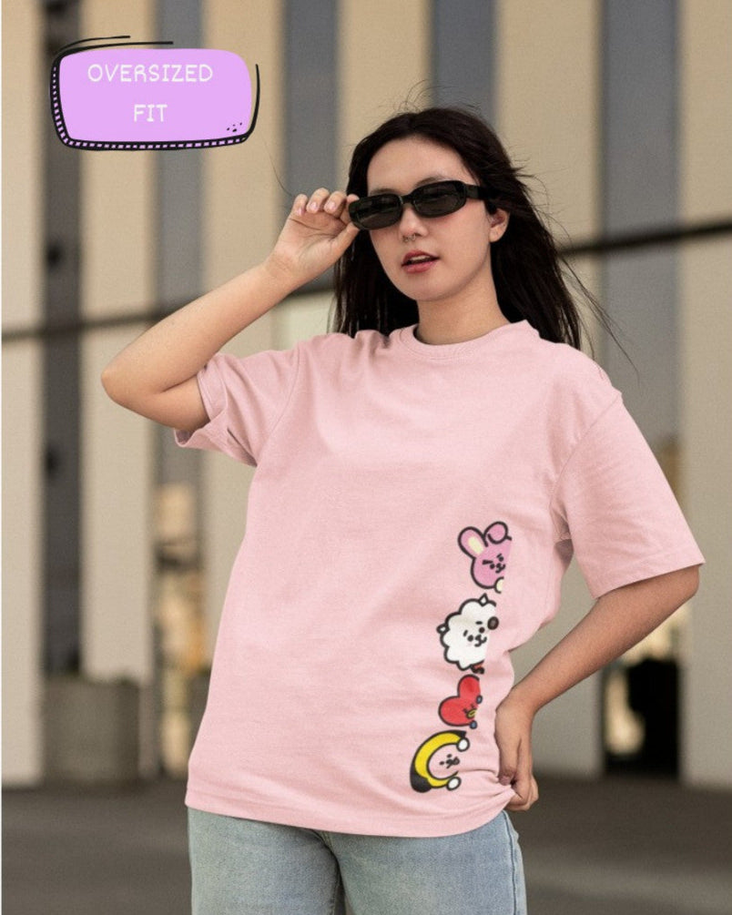 Female Model wearing the Peeking Army printed Light Pink oversized t-shirt paired with jeans for a casual look