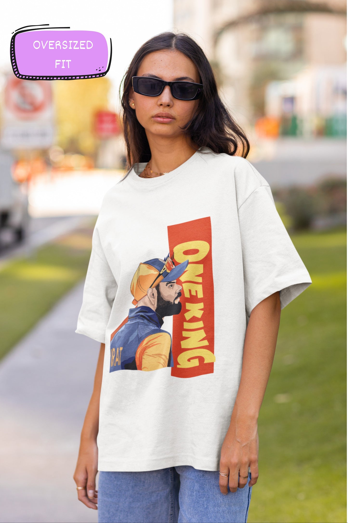 White oversized T-shirt showcasing a dynamic "One King Kohli" graphic design, perfect for making a bold style statement.