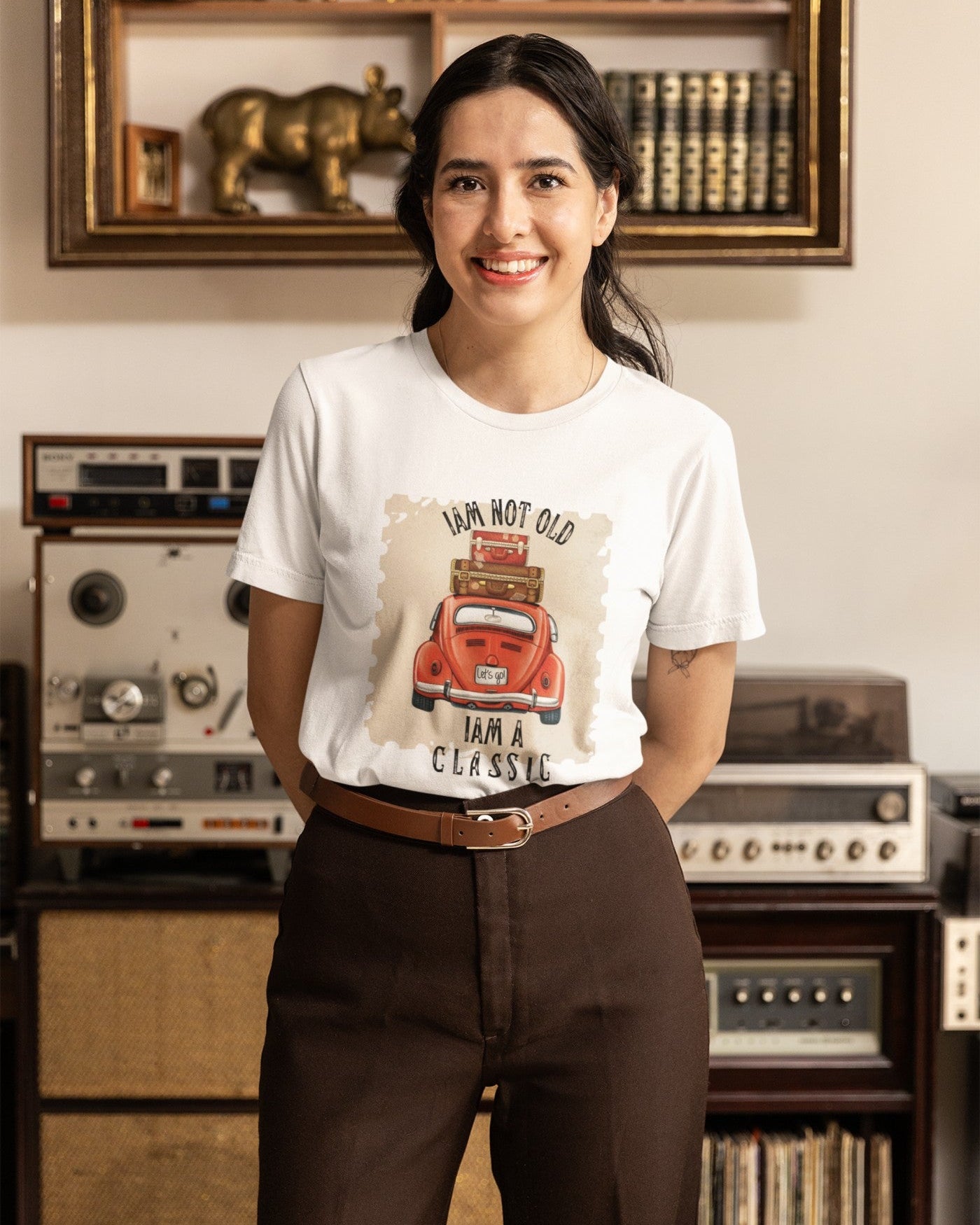 Model wearing the 'I Am a Classic' printed white T-shirt paired with jeans for a casual look.
