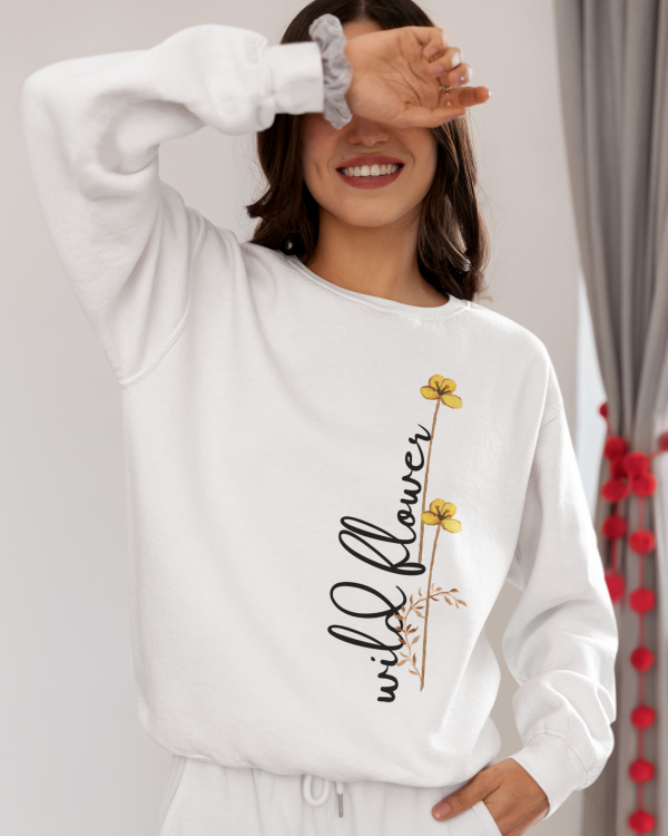 Model wearing the women's wild flower printed white sweatshirt styled for casual elegance.