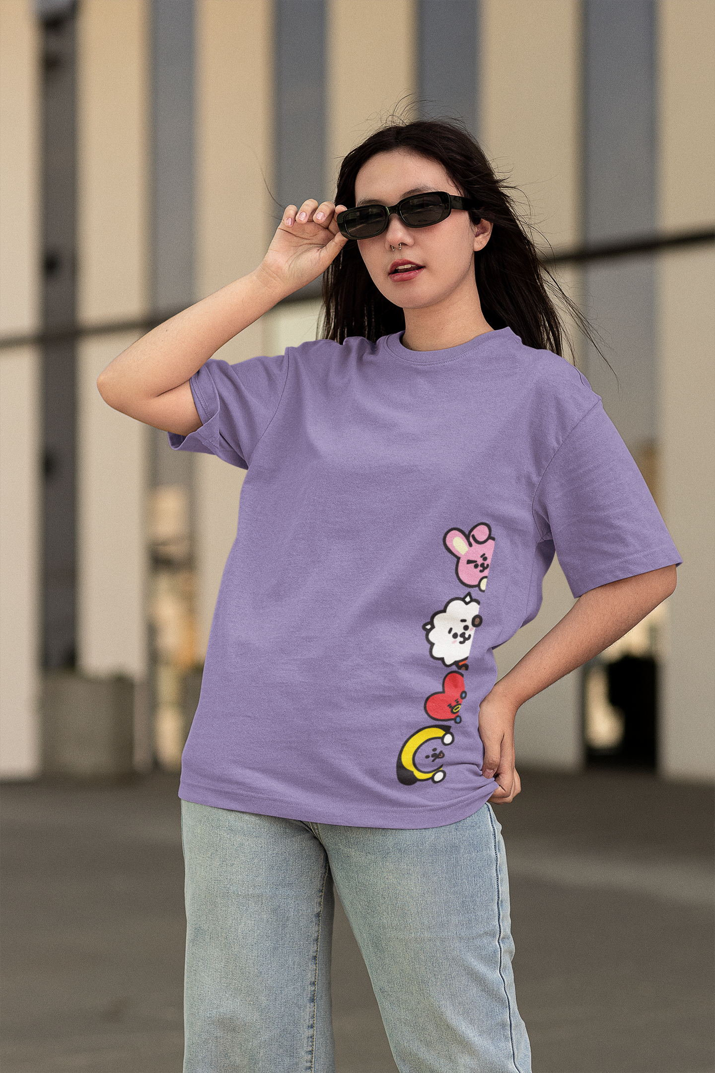 Male Model wearing the Peeking Army printed lavender oversized t-shirt paired with jeans for a casual look