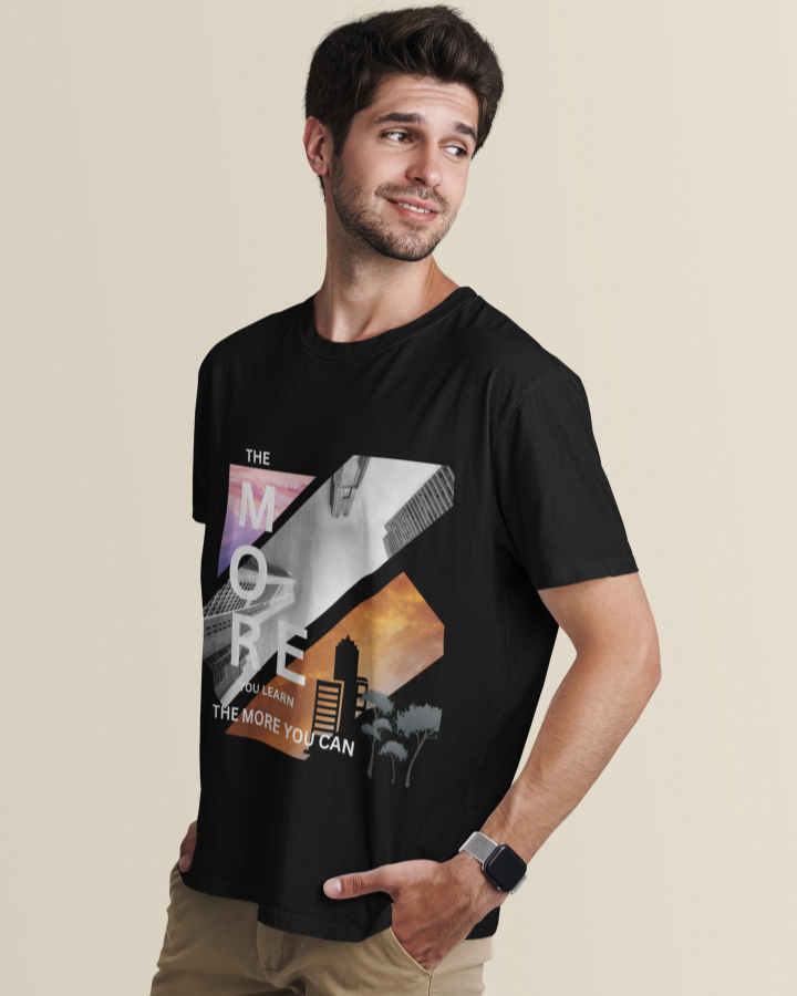 Men Model wearing 'The More You Learn' printed black t-shirt, paired with jeans for a casual look.