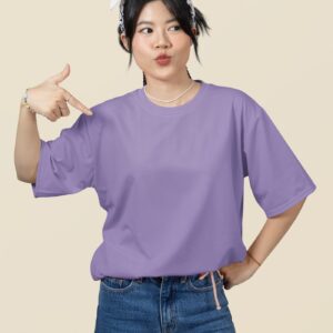 oversized mockup featuring a woman pointing at her round neck t shirt in a studio m51459