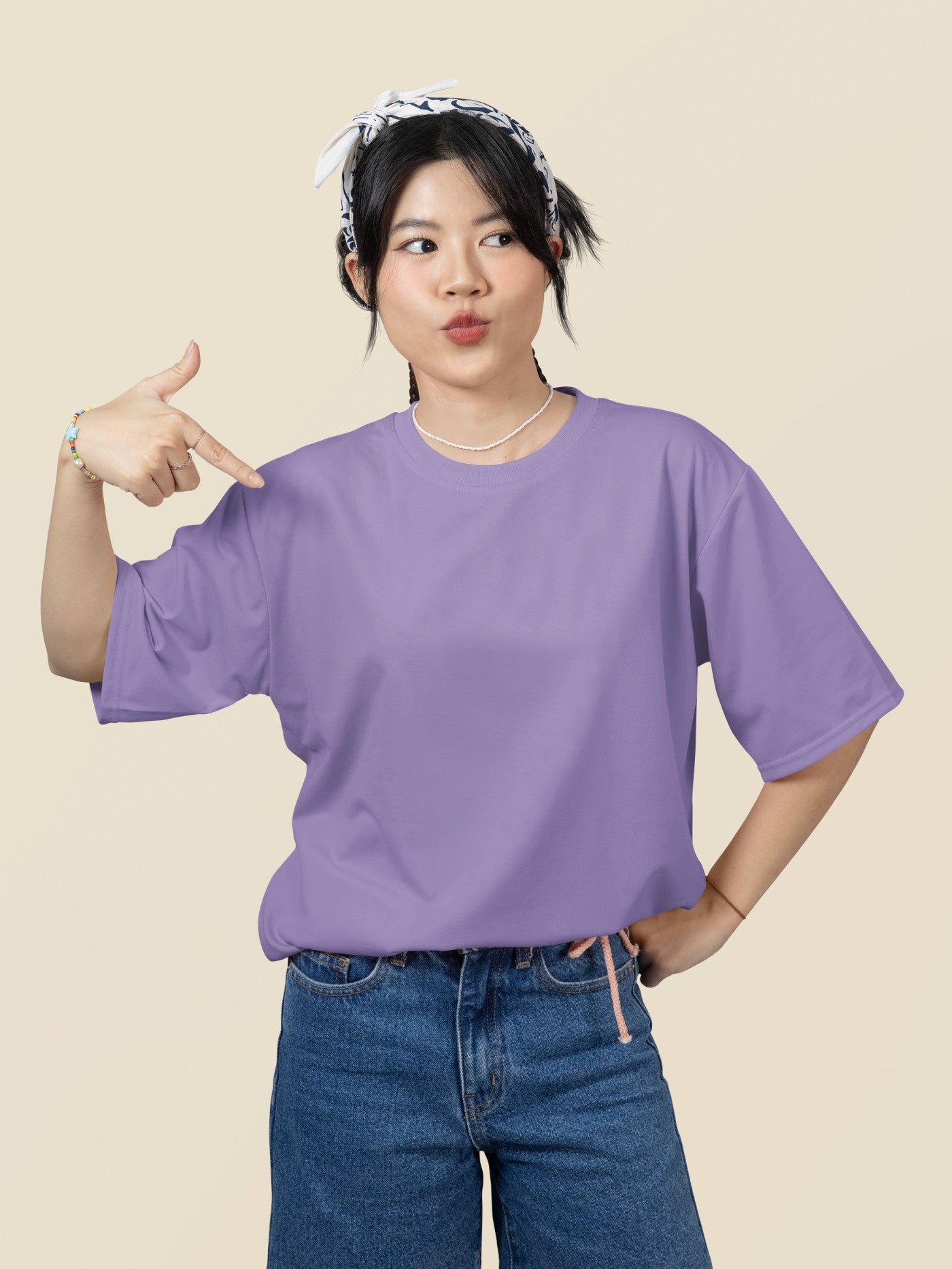 oversized mockup featuring a woman pointing at her round neck t shirt in a studio m51459 oversized mockup featuring a woman pointing at her round neck t shirt in a studio m51459