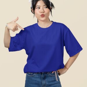 oversized mockup featuring a woman pointing at her round neck t shirt in a studio m51459 12