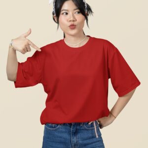 oversized mockup featuring a woman pointing at her round neck t shirt in a studio m51459 5